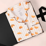 Women's Short Sleeve Cropped Pajama Set in Croissant print packed in a box on a white background
