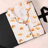 Women's Short Sleeve Cropped Pajama Set in Croissant print packed in a box on a white background