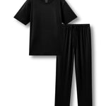 Men's pajama set featuring a black crew neck tee and black pajama lounge pants against a white background