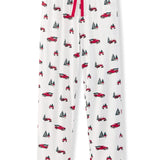 White pajama pants with an all-over red and black holiday truck and pine tree print, featuring a red drawstring waist.