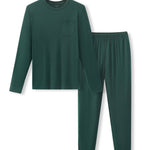 A two-piece dark green pajama set consisting of a long-sleeve crewneck shirt with a chest pocket and matching elastic-waist pants, displayed on a clean white background.