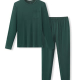 A two-piece dark green pajama set consisting of a long-sleeve crewneck shirt with a chest pocket and matching elastic-waist pants, displayed on a clean white background.