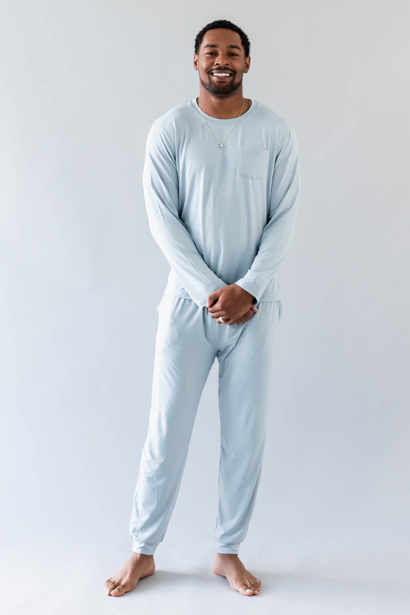 Smiling model wearing the Men's Jogger Set in Fog