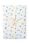 Throw blanket in Amalfi Coast folded and packaged with a cream ribbon 