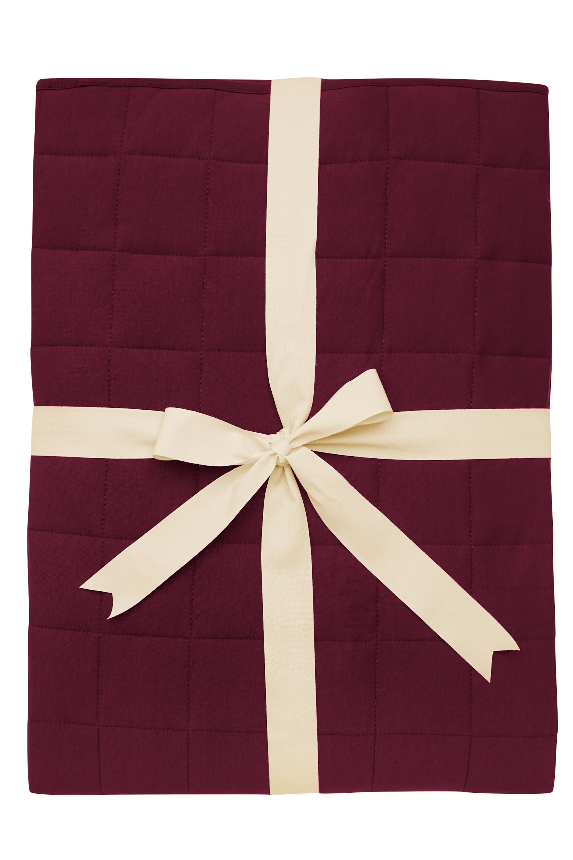 Product photo of the Kyte Bamboo Throw Blanket in Burgundy 2.5 while wrapped in an ivory bow
