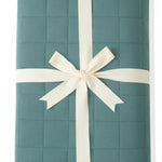 Youth Blanket in Pine 2.5 wrapped in a ribbon bow on a white background