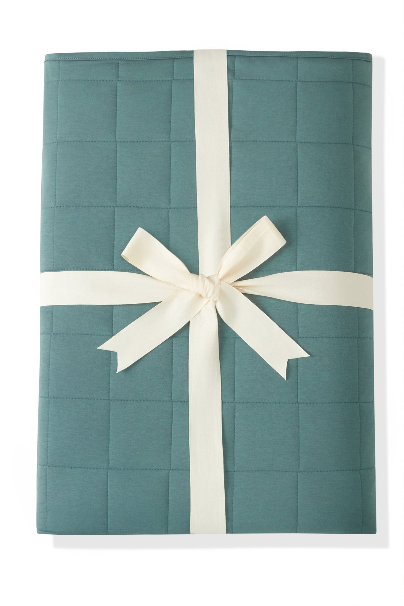 Youth Blanket in Pine 2.5 wrapped in a ribbon bow on a white background
