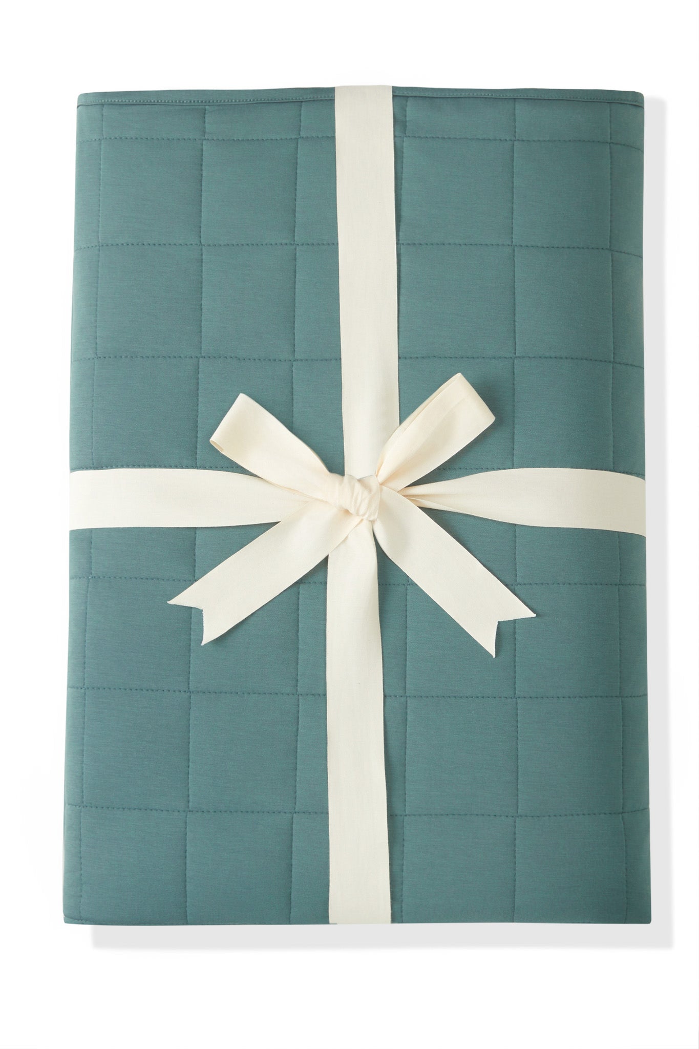 Youth Blanket in Pine 2.5 wrapped in a ribbon bow on a white background