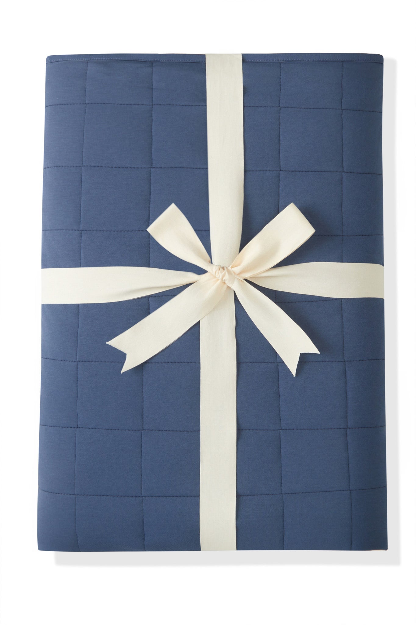Youth Blanket in Oxford 2.5 wrapped in a ribbon bow on a white background