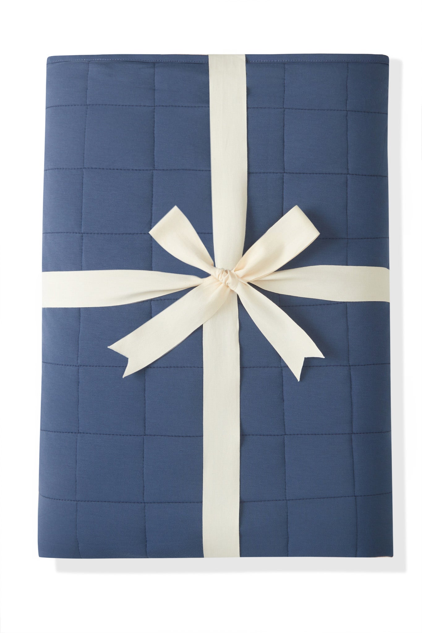 Youth Blanket in Oxford 2.5 wrapped in a ribbon bow on a white background