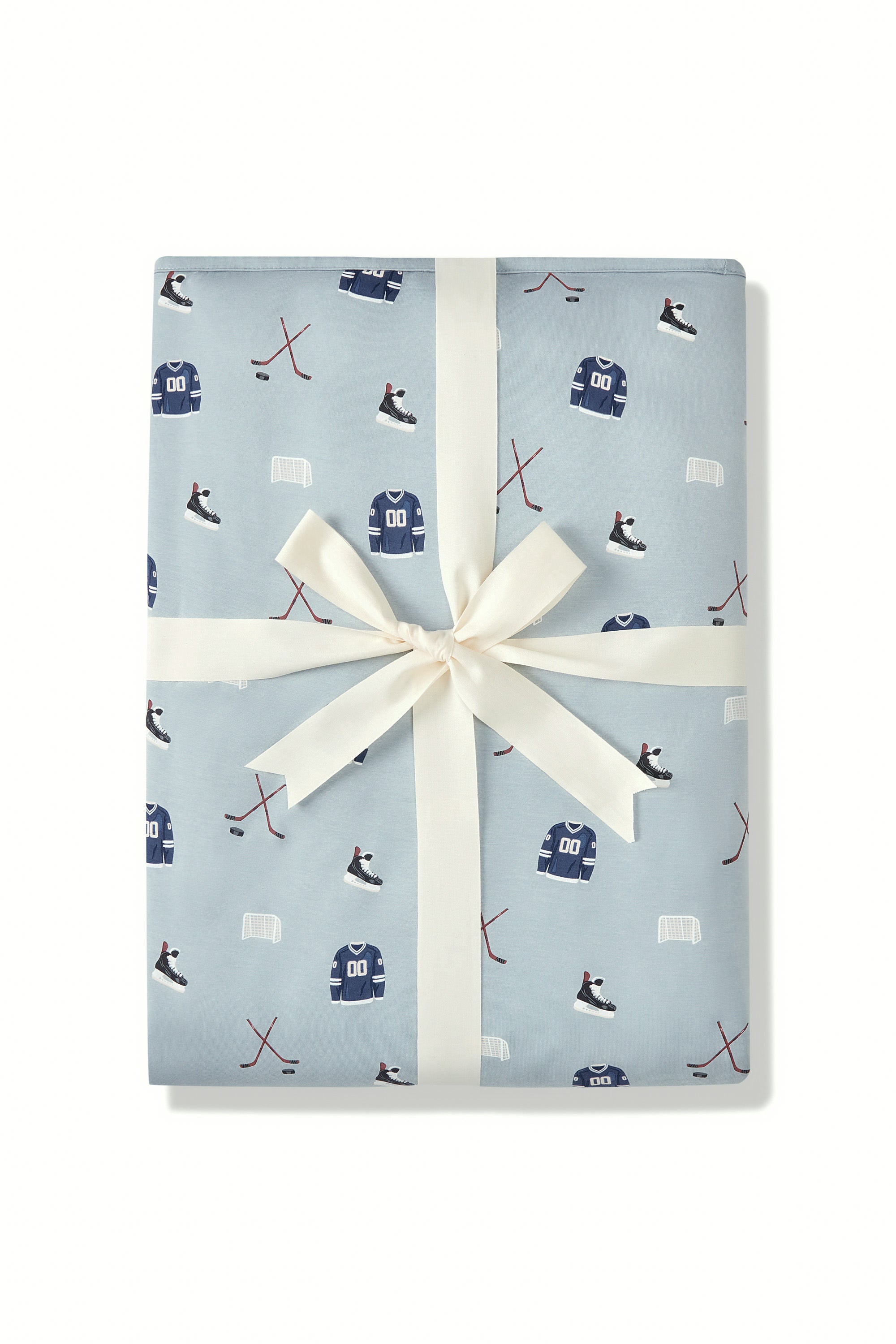 Throw Blanket in Vintage Hockey 2.5 print packed in a ribbon on a white background