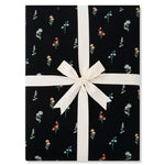 Folded Throw Blanket in Midnight Wildflower 2.5 wrapped in an ivory ribbon