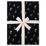 Folded Throw Blanket in Midnight Wildflower 2.5 wrapped in an ivory ribbon