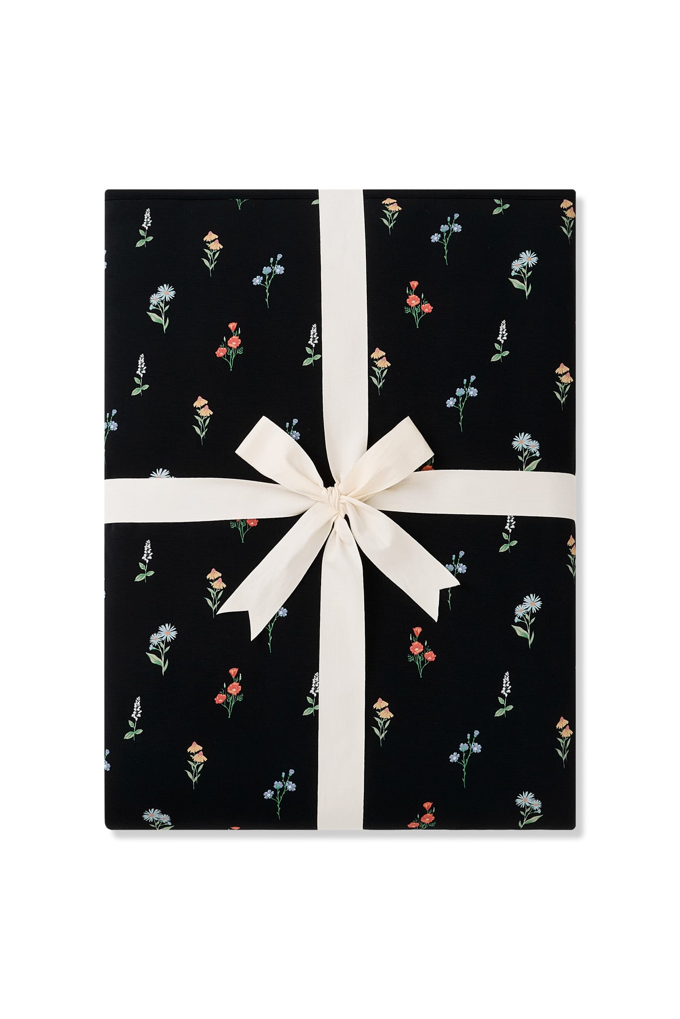 Folded Throw Blanket in Midnight Wildflower 2.5 wrapped in an ivory ribbon
