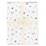 Folded Bamboo Throw Blanket in Home Run 1.0 wrapped in an ivory bow