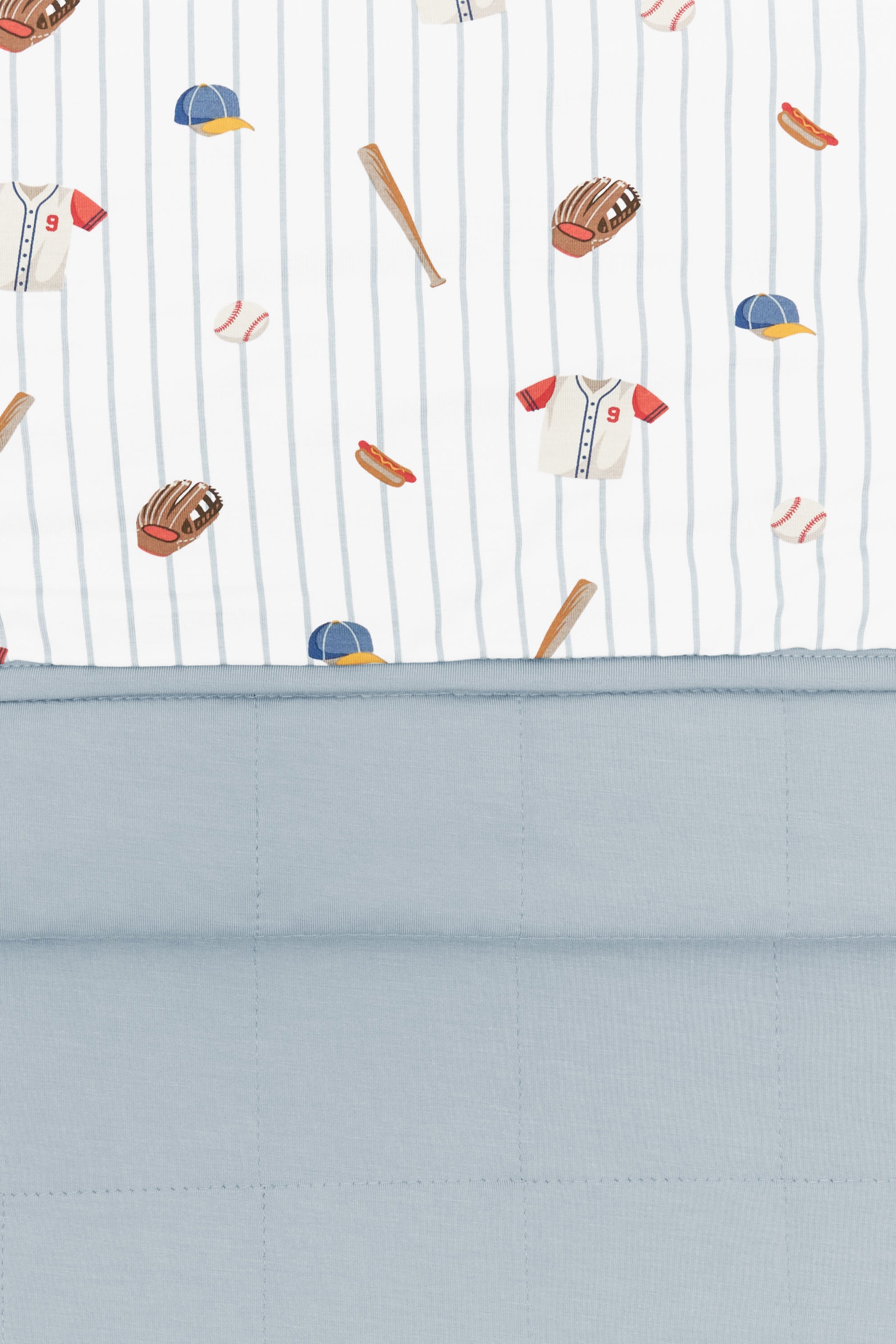 Close up of olded Bamboo Throw Blanket in Home Run 1.0 displaying printed and quilted sides