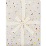 Product photo of a folded Throw Blanket in Starry Icon 1.0 wrapped in an ivory bow 
