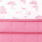 Close up of the Bamboo Throw Blanket in Toile Ballet 1.0 showcasing the printed and quilted sides