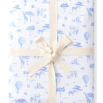 Folded up Bamboo Throw Blanket in Toile Safari 1.0 wrapped in an ivory bow