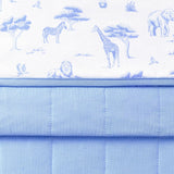 Close up of folded Bamboo Throw Blanket in Toile Safari 1.0 showcasing the printed and quilted side