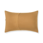 Back side of Standard Pillowcase in Ochre on a white background