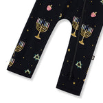 Bottom part of Black Zippered Romper in Hanukkah Nights print on a white background