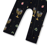 Bottom part of Black Zippered Romper in Hanukkah Nights print on a white background
