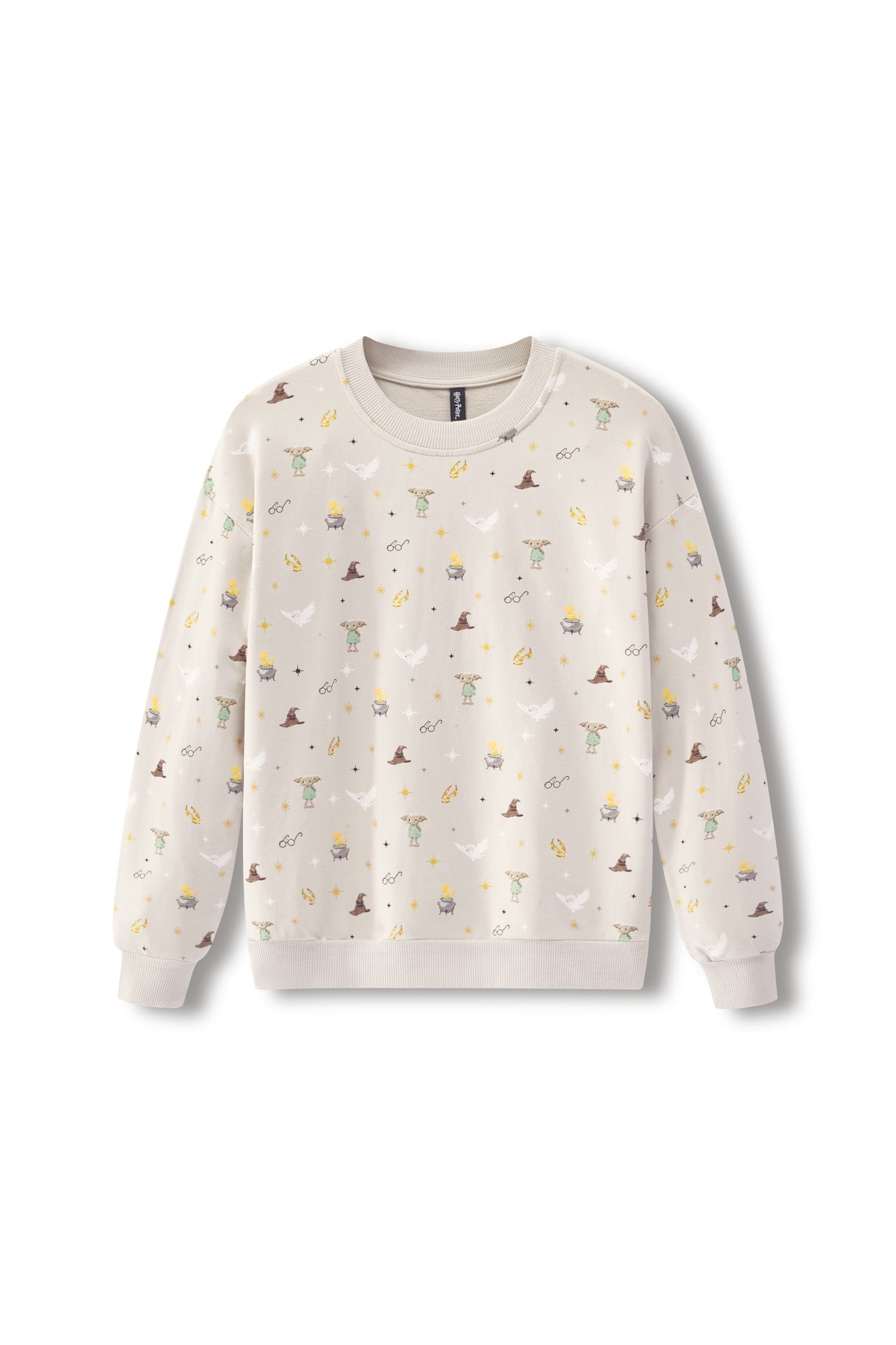 A cream-colored crewneck sweatshirt with an all-over print of small whimsical illustrations, including wizards, cauldrons, stars, and moons, displayed on a clean white background.