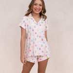Smiling model wearing the Bamboo Women's Short Sleeve Pajama Set in Pastel Ghost