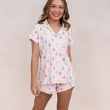 Smiling model wearing the Bamboo Women's Short Sleeve Pajama Set in Pastel Ghost