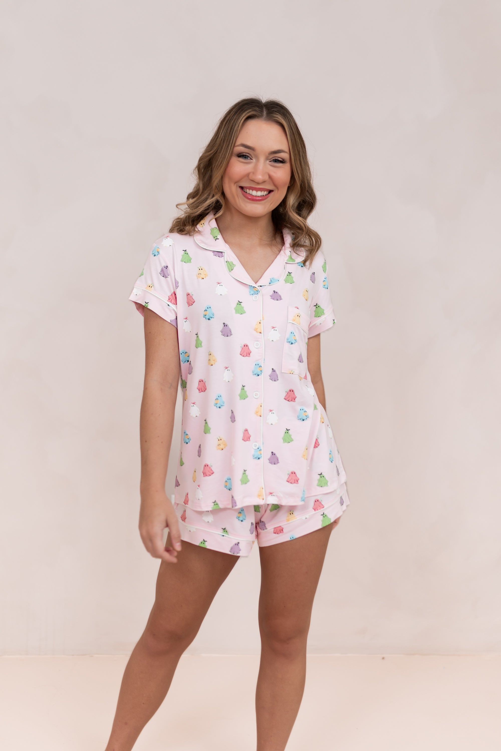 Smiling model wearing the Bamboo Women's Short Sleeve Pajama Set in Pastel Ghost