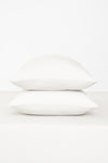 Fitted Sheet with Pillowcases in Cloud. Showing 2 pillows stacked on a sheet