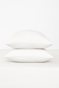 Fitted Sheet with Pillowcases in Cloud. Showing 2 pillows stacked on a sheet