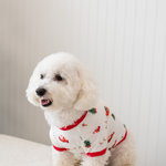 The side view of the Dog Tee in Santa Sleigh shown on a small white dog