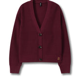 A burgundy ribbed knit cardigan sweater with a V-neck, three dark buttons, and a small tan brand patch on the lower left hem, displayed on a clean white background.