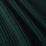 Close-up of a dark forest green ribbed knit fabric texture with a fine waffle pattern.