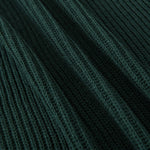 Close-up of a dark forest green ribbed knit fabric with a textured vertical stripe pattern.