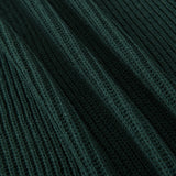 Close-up of a dark forest green ribbed knit fabric with a textured vertical stripe pattern.