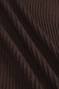 Close-up of dark brown ribbed knit fabric with a textured vertical stripe pattern.