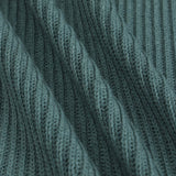 Close-up of a ribbed knit fabric in a muted blue-green color, showing the detailed texture and folds of the material.