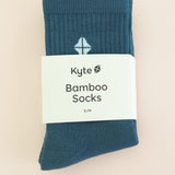 Adult Crew Socks in Atlantic shown in its packaging on a light taupe surface