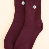 Adult Crew Socks in Burgundy shown side by side on a light neutral background