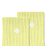 Top part of Adult Crew Socks in Citron with Kyte Baby logo on a white background