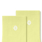 Top part of Adult Crew Socks in Citron with Kyte Baby logo on a white background