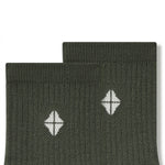 Top part of Adult Crew Socks in Fir with Kyte Baby logo on a white background