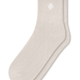 Adult Crew Socks in Oat laying flat on a white background.