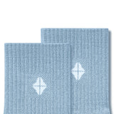 Top part of Adult Crew Socks in Breeze with Kyte Baby logo on a white background