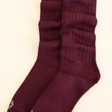 Adult Scrunch Socks in Burgundy shown laying side by side on a  light neutral background