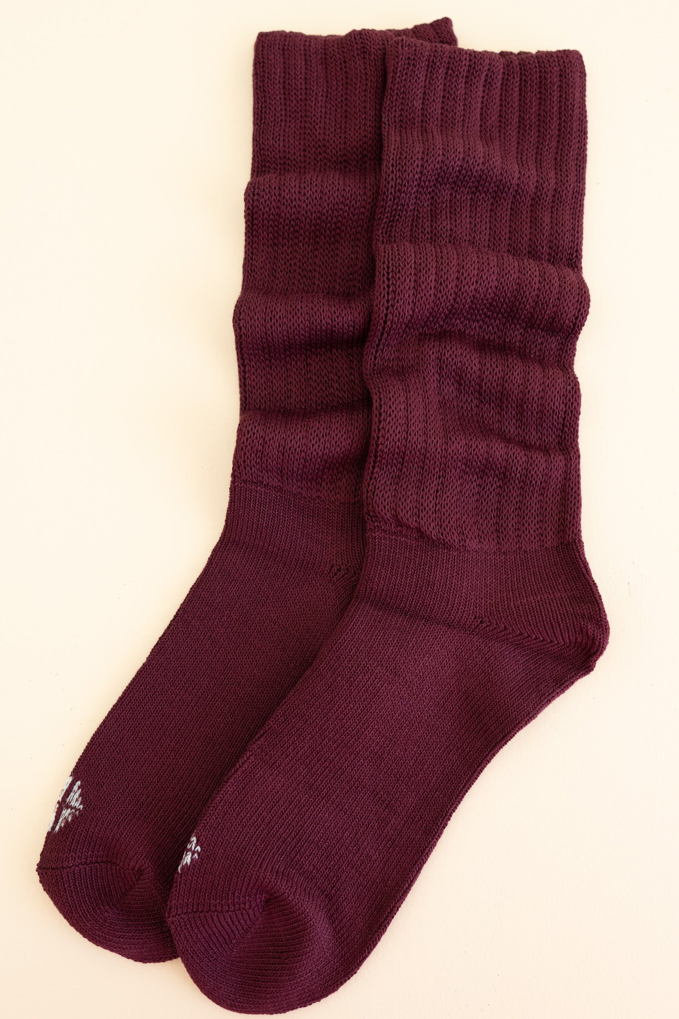 Adult Scrunch Socks in Burgundy shown laying side by side on a  light neutral background