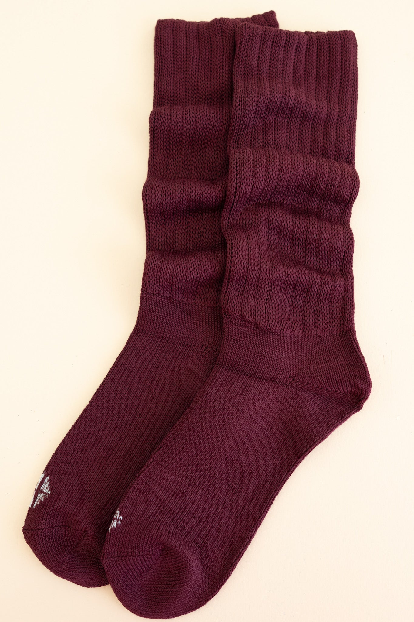 Adult Scrunch Socks in Burgundy shown laying side by side on a  light neutral background
